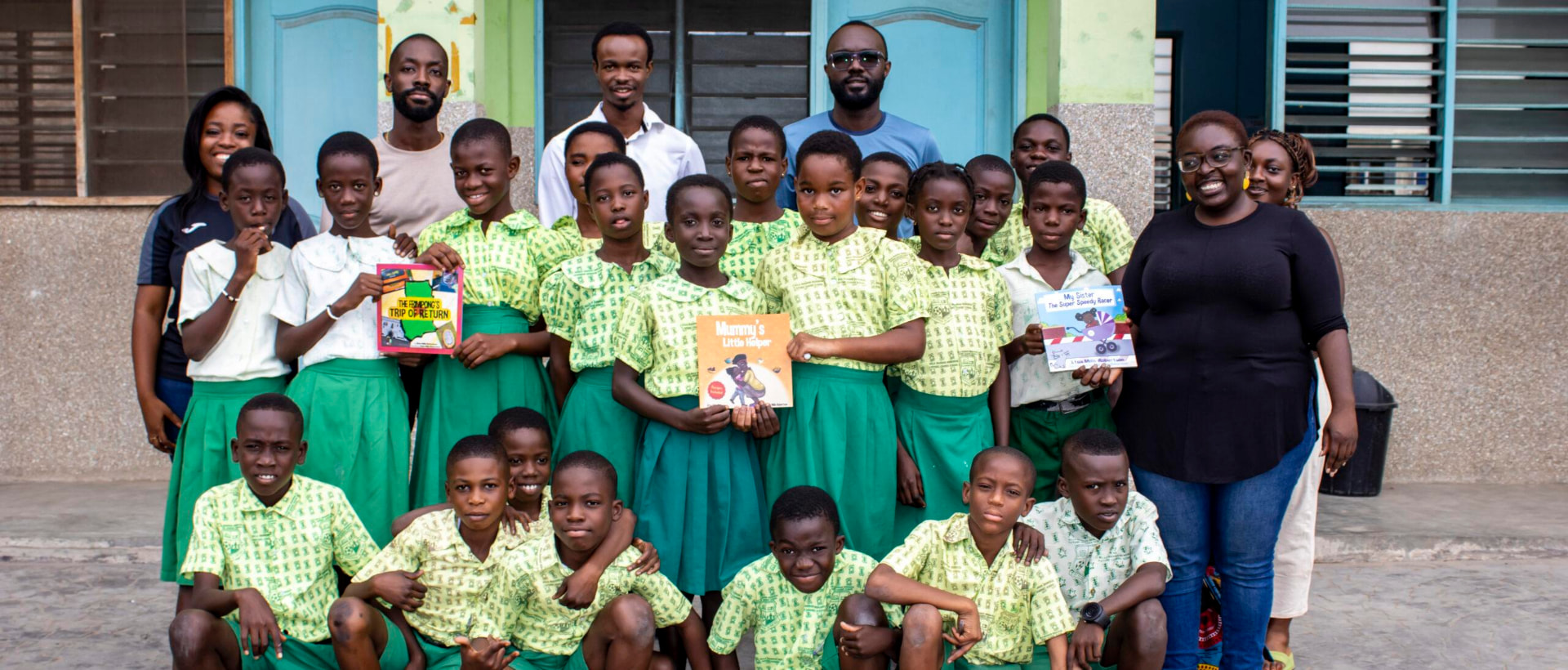 Pupils and teachers with newly donated storybooks