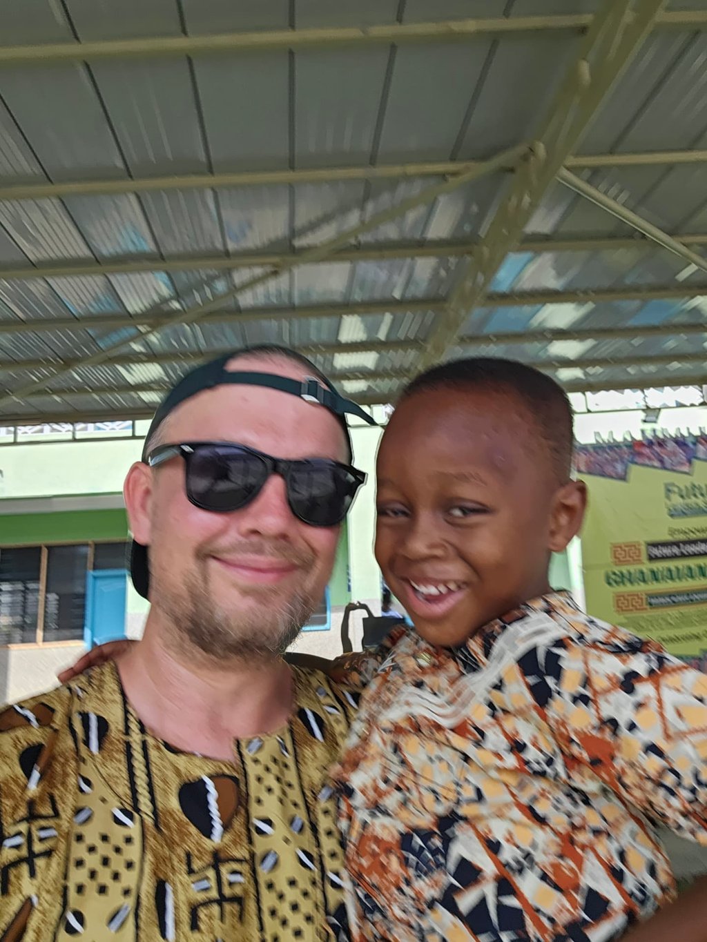 A volunteer and a smiling child at a Future Stars event