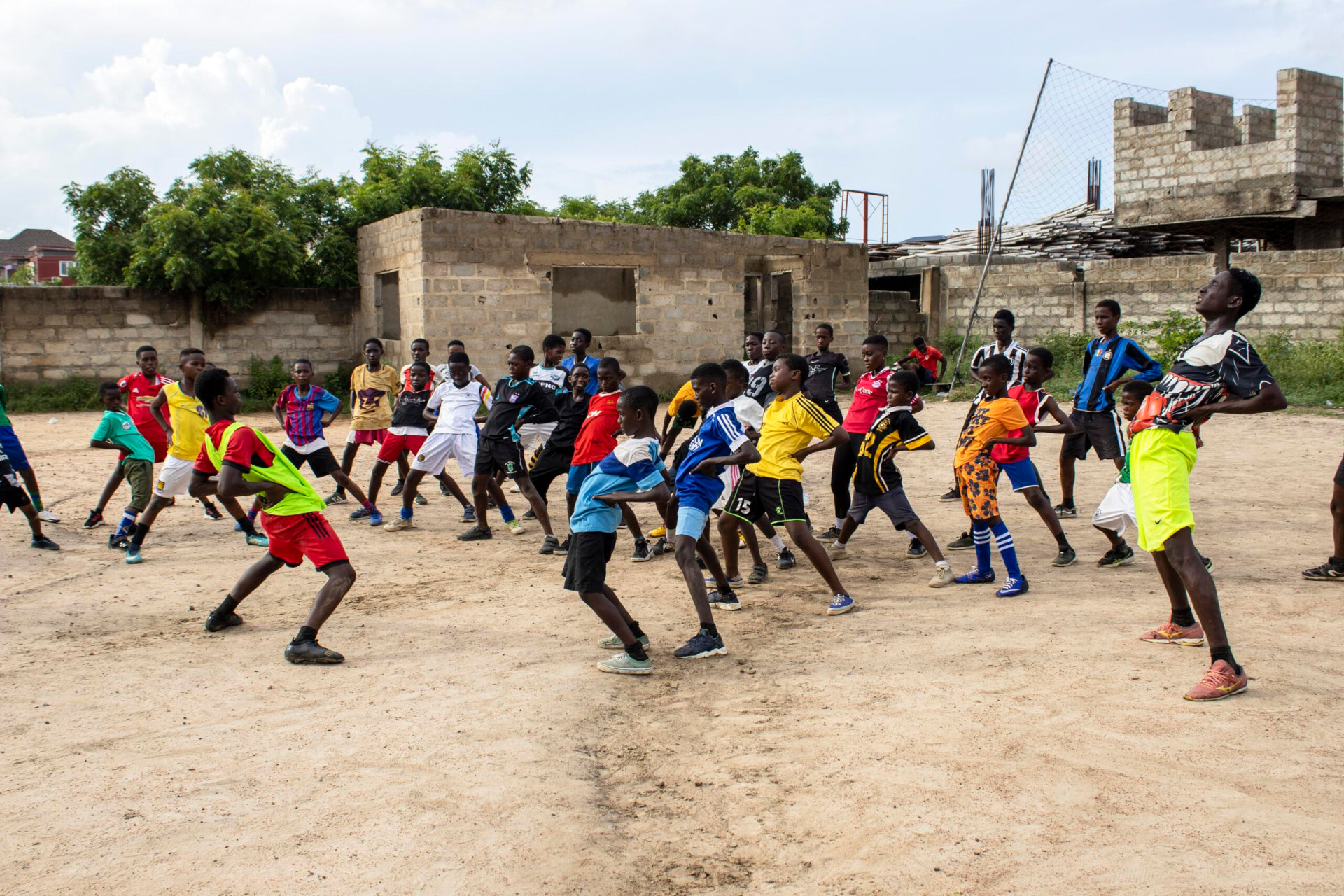 Young people warming up before a football training session